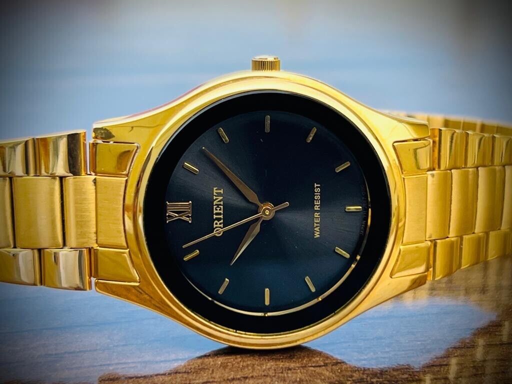 Orient quartz gold watch on sale
