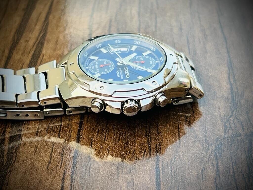 VINTAGE SEIKO 100m BLUE DIAL QUARTZ CHRONOGRAPH GENTS WRIST WATCH 7T94-0AN0 - Grab A Watch Co
